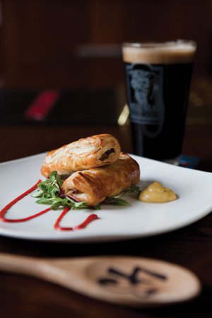 Bull’s Head Public House: A few things you won’t find anywhere else in the area: Harviestoun Old Engine Oil cask-conditioned ale with homemade sausage rolls wrapped in puff pastry and wooden paddles with order numbers on them